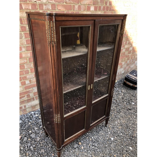 53 - A continental glazed display cabinet with marble inset top, reeed columns with brass mounts 80x40x14... 