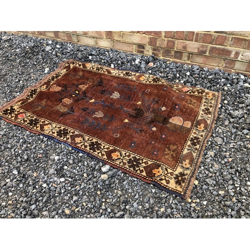 59 - A brown Oriental pattern rug