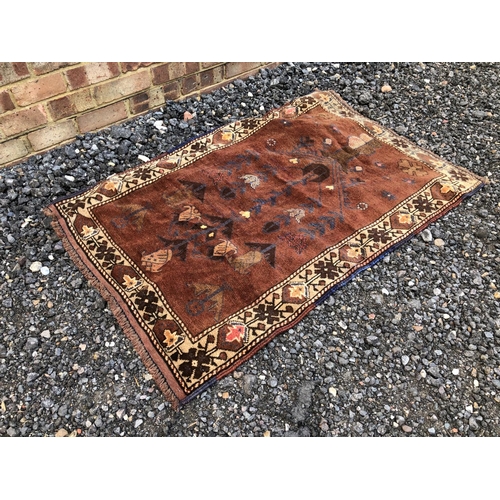 59 - A brown Oriental pattern rug