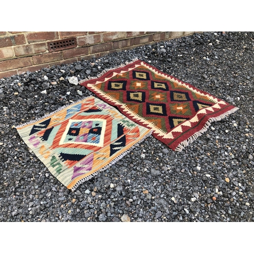 60 - Two bright coloured Kilem rugs