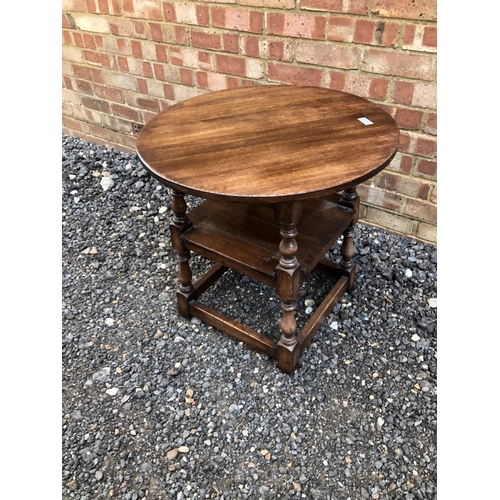 61 - A circular oak occasional table