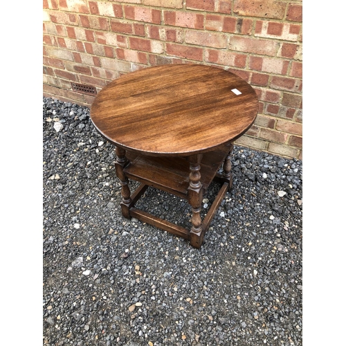 61 - A circular oak occasional table