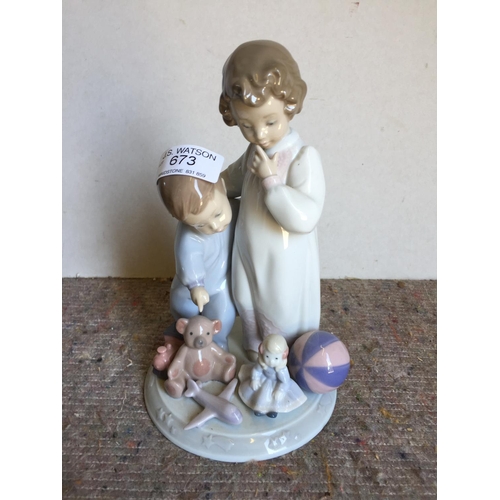 673 - Lladro Figure Boy and girl and toys