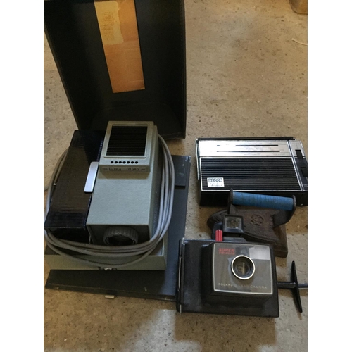 676 - Polaroid Camera, projector and iron