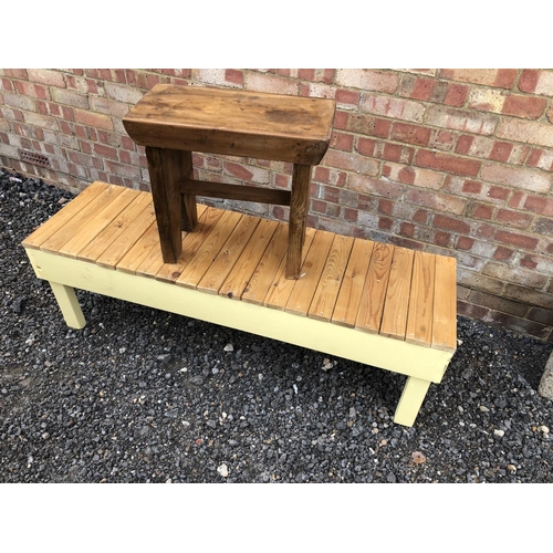 72 - A pine bench with a slatted top together with a pine stool