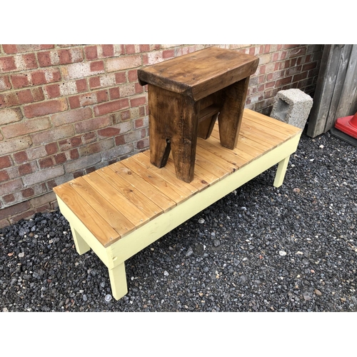 72 - A pine bench with a slatted top together with a pine stool