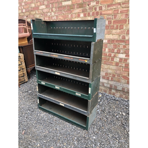 8 - A green metal six section stacking shelving system 90x30x140