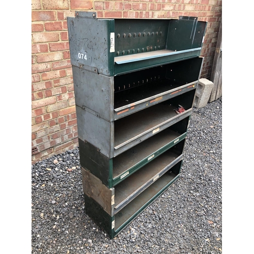 8 - A green metal six section stacking shelving system 90x30x140