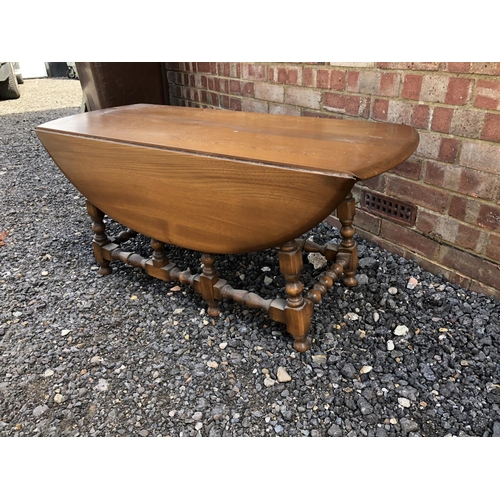 89 - An Ercol golden dawn drop leaf coffee table 107x41x48