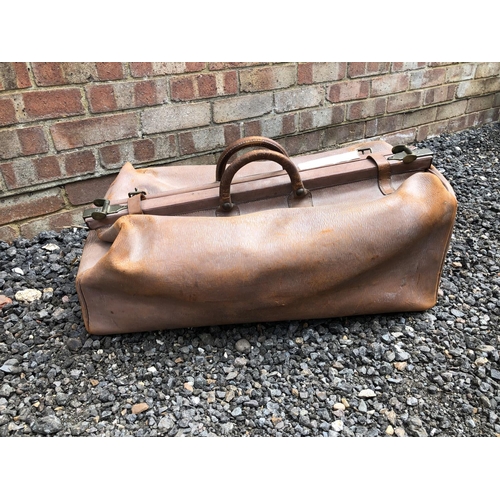 9 - A large vintage brown leather hold-all bag