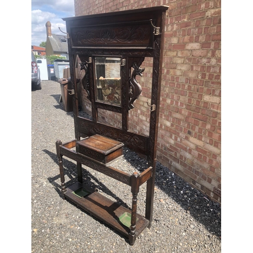 96 - A carved oak hallstand with dragon decoration 102x28x190