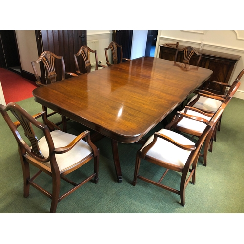 208 - A large extending mahogany board room table with 8 carver chairs
This lot remains located in a offic... 