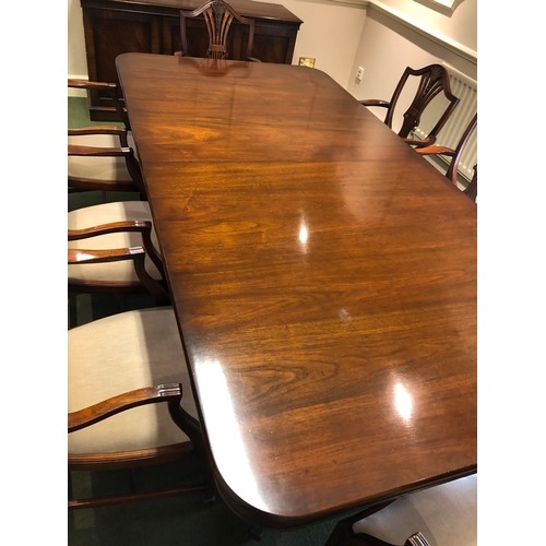 208 - A large extending mahogany board room table with 8 carver chairs
This lot remains located in a offic... 