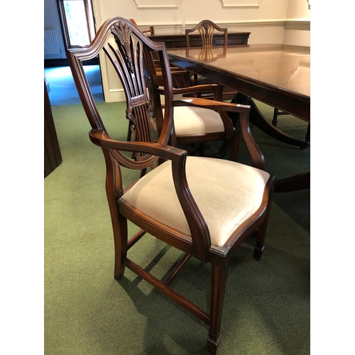 208 - A large extending mahogany board room table with 8 carver chairs
This lot remains located in a offic... 