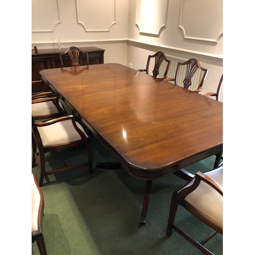 208 - A large extending mahogany board room table with 8 carver chairs
This lot remains located in a offic... 