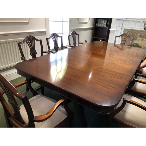 208 - A large extending mahogany board room table with 8 carver chairs
This lot remains located in a offic... 