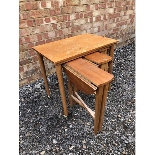 103 - A 1970's teak nest of four tables