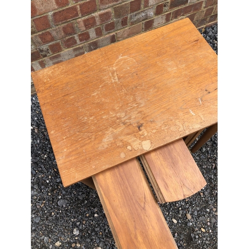 103 - A 1970's teak nest of four tables