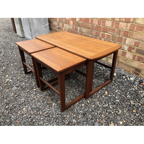 104 - A teak nest of three tables