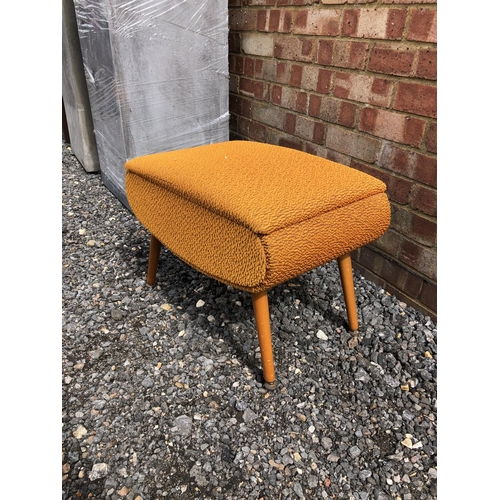 107 - A 1970's orange upholstered sewing box / ottoman