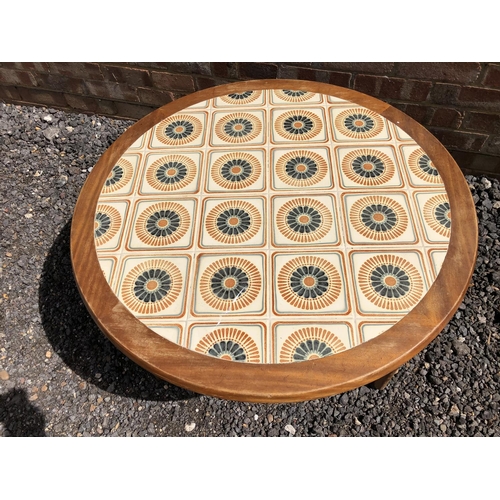 111 - A 1970's teak tile top coffee table with x frame base