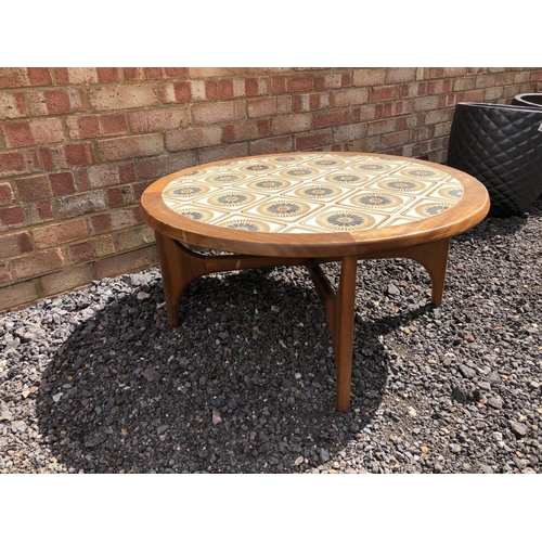 111 - A 1970's teak tile top coffee table with x frame base