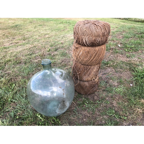 14 - Glass carboy bottle together with four rolls vintage twine