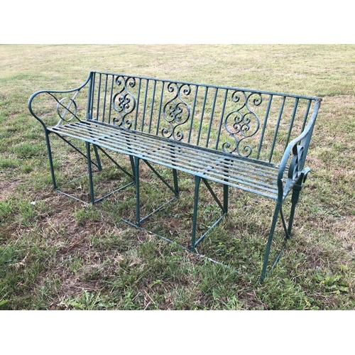 2 - A Victorian green painted ornate iron garden bench 150cm wide