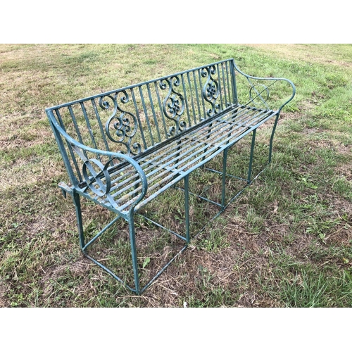 2 - A Victorian green painted ornate iron garden bench 150cm wide