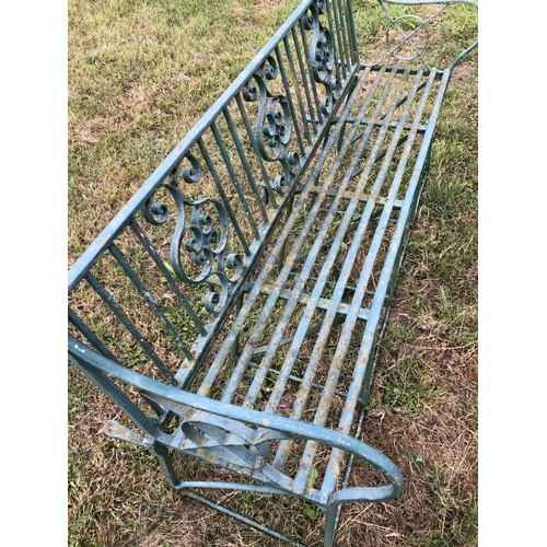 2 - A Victorian green painted ornate iron garden bench 150cm wide