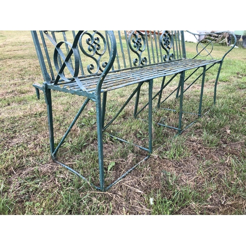 2 - A Victorian green painted ornate iron garden bench 150cm wide