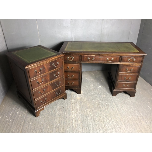 29 - A reproduction Mahoney pedestal desk together with a matching two drawer filing cabinet