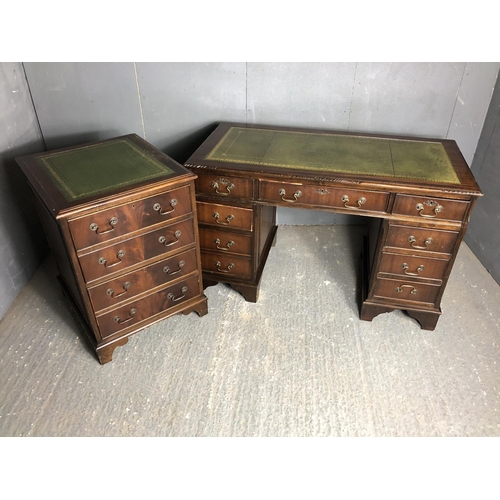 29 - A reproduction Mahoney pedestal desk together with a matching two drawer filing cabinet