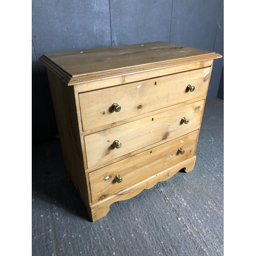 35 - A solid pine chest of three drawers