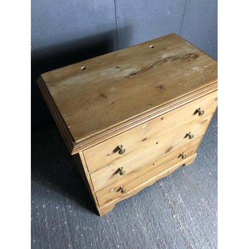 35 - A solid pine chest of three drawers