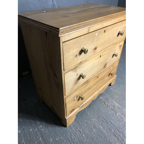 35 - A solid pine chest of three drawers