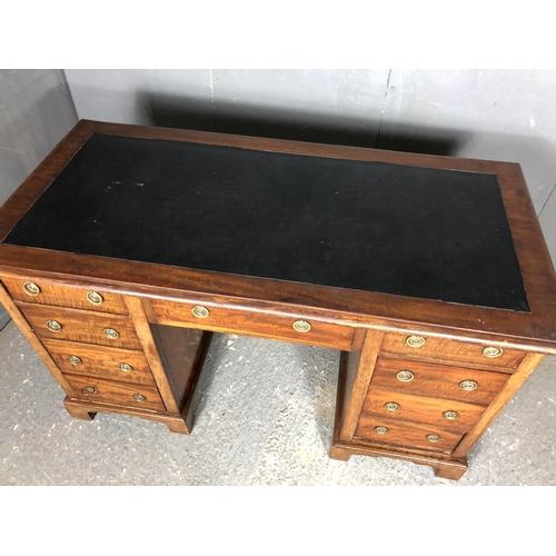 36 - A Victorian mahogany kneehole desk