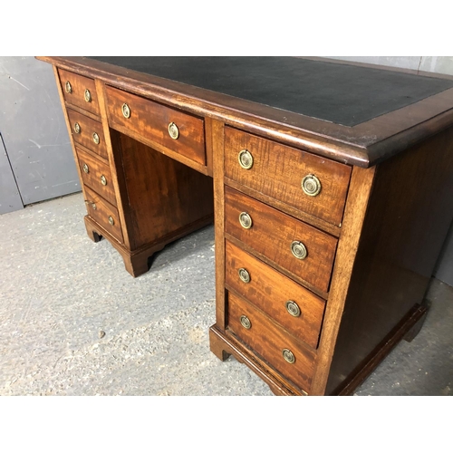 36 - A Victorian mahogany kneehole desk