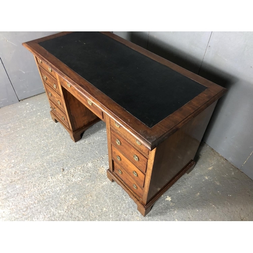 36 - A Victorian mahogany kneehole desk