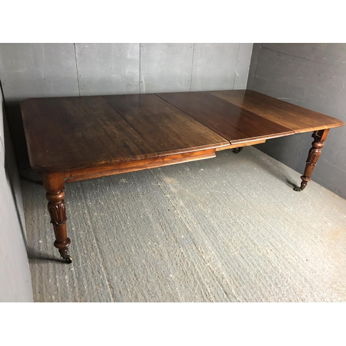 37 - A Victorian mahogany dining table, sliding to house two extension leaves 238x121cm