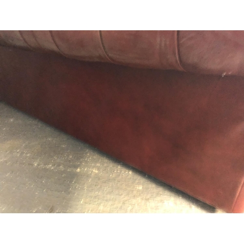 40 - A red leather three seat Chesterfield sofa by Pegasus