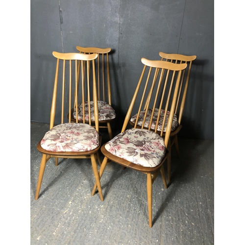 43 - A set of four blonde ercol stick back chairs