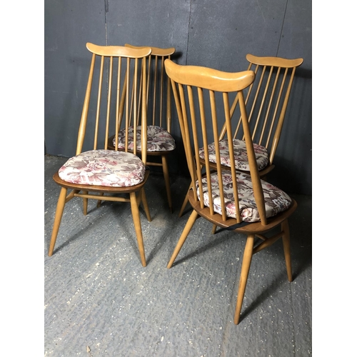 43 - A set of four blonde ercol stick back chairs