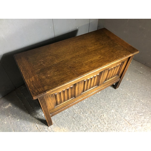 46 - A small oak linenfold blanket box