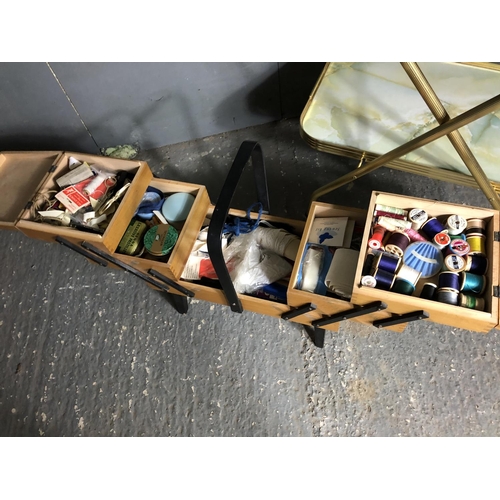 51 - A concertina sewing box together with an aluminium tea trolley