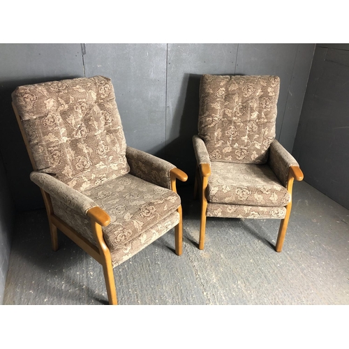 64 - A pairmof upright brown armchairs