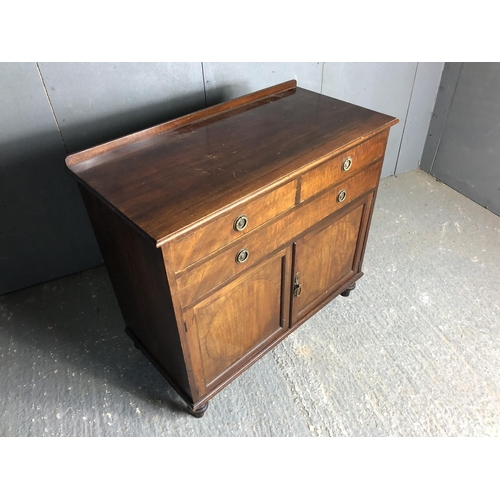 78 - An Edwardian mahogany three drawer sideboard