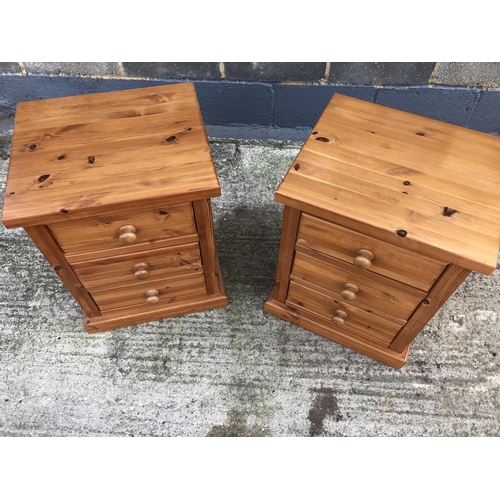 103 - A pair of good quality modern pine bedside chests of three