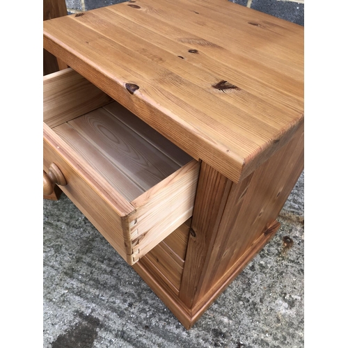 103 - A pair of good quality modern pine bedside chests of three