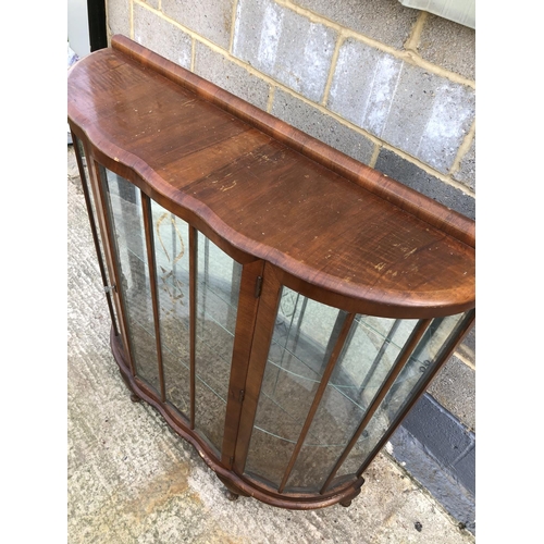 111 - A 1930's walnut china display cabinet with glass shelves and mirror back 106 wide